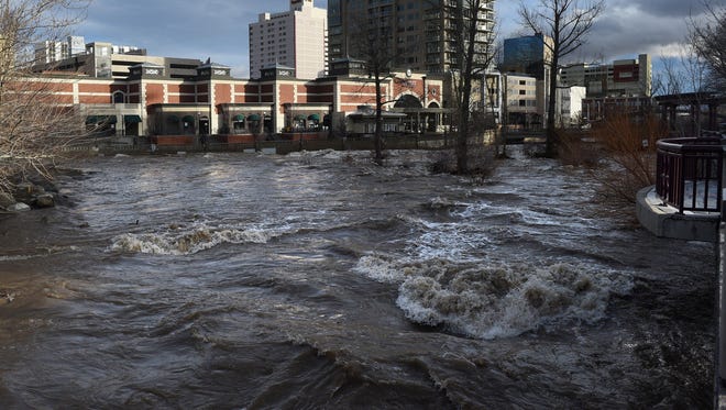 The Truckee River is seen flowing through downtown Reno on Monday, Jan. 9, 2017.