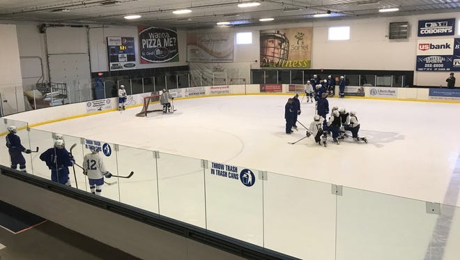 The Sartell boys hockey practice works on a defensive zone drill during practice Tuesday at Bernick's Arena in Sartell. The Sabres are 6-2 and ranked No. 8 in Class 1A.