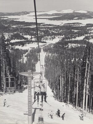Skiers ride the ski lift at Sunrise Ski Resort on January 20, 1982.