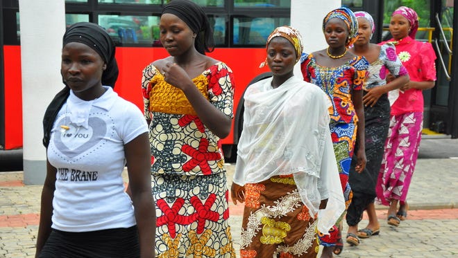Girls who escaped abduction arrive in Abuja, Nigeria, on July 22.
