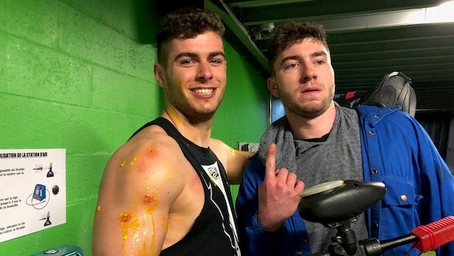 Michigan kicker Quinn Nordin and quarterback Shea Patterson pose for photos after a paintball competition Monday, April 30, 2018. The Michigan team also visited the Palace of Versailles on Monday.