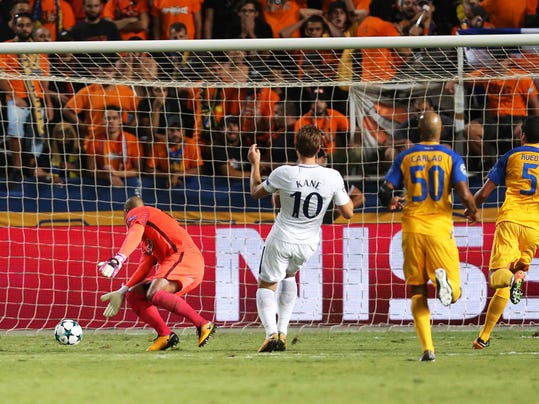 Tottenham's Harry Kane, second left, shoots to score against APOEL x during the Champions League Group H soccer match between APOEL Nicosia and Tottenham Hotspur at GSP stadium, in Nicosia, Cyprus, on Tuesday, Sept. 26, 2017. (AP Photo/Petros Karadjias)