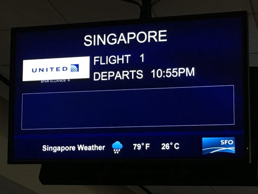 A departure board shows information for United's inaugural