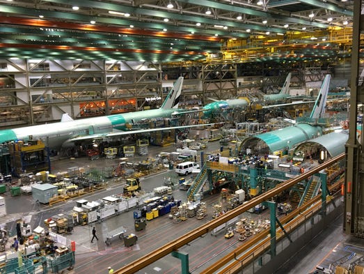 Boeing 777s move through Boeing's assembly line in