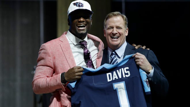 Western Michigan's Corey Davis, left, poses with NFL Commissioner Roger Goodell after being selected by the Titans during the first round of the 2017 NFL football draft, Thursday, April 27, 2017, in Philadelphia.