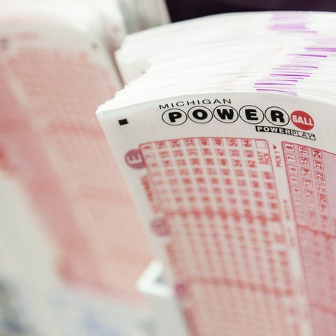 Slips for the Michigan Powerball sit on the counte