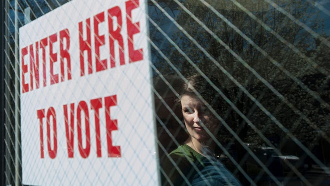 Eliza Bordley looks out the window while waiting to vote at the Durham School of the Arts in Durham, N.C., in 2016.