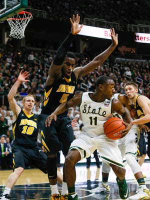Michigan State Spartans Lourawls Nairn Jr. spins towards the basket against Iowa Hawkeyes Athony Clemmons, during the second half at the Jack Breslin Student Events Center in East Lansing, Mich. on Thursday, Jan. 14, 2016. Kimberly P. Mitchell/Detroit Free Press