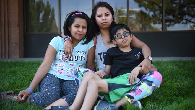 DACA recipient Maria Roberto poses for a portrait with her children, Ashlee Romano, left, and Gerardo Mederos, in Reno on May 27, 2017. Jason Bean/Reno Gazette-Journal- USA TODAY NETWORK