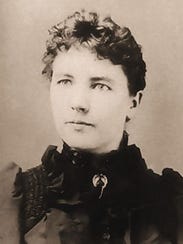 The American writer Laura Ingalls Wilder is photographed around 1885.
