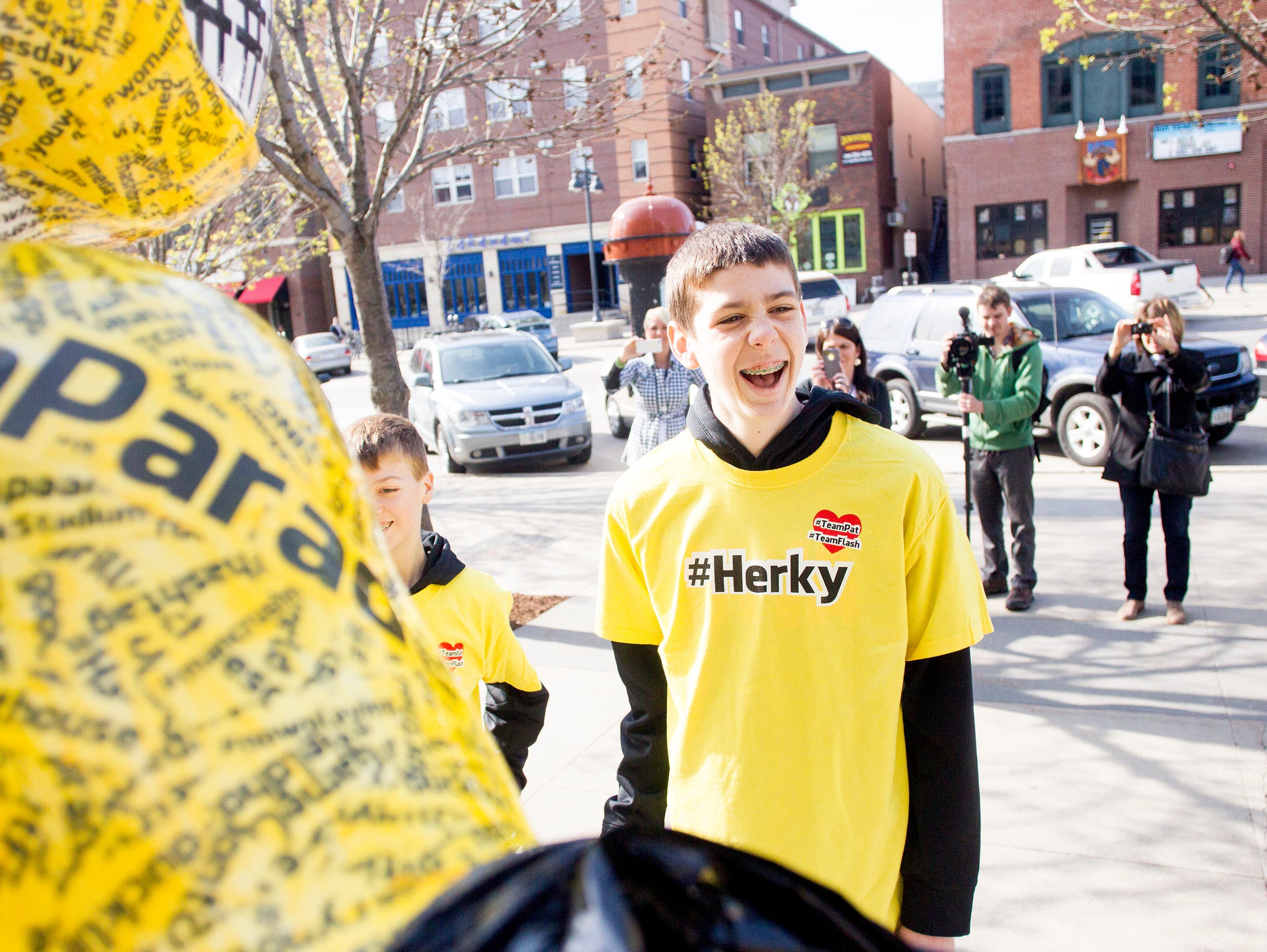Patrick McCaffery, son of Iowa Men's Basketball Head Coach Fran McCaffery, smiles as he unveils the #Herky statue as part of the Herky on Parade series along Iowa Avenue in Iowa City, IA on Monday morning, May 5, 2014. Patrick, 14, had a tumor surgically removed from his thyroid in March 2014, which was shown to be cancerous. He was asked to unveil the #Herky statue after his own #TeamPat was recognized across the country including NBA star Chris Paul with the L.A. Clippers.