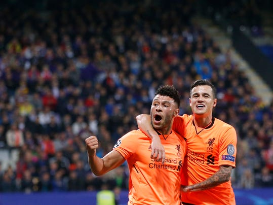 Liverpool's Alex Oxlade-Chamberlain, left, celebrates with Philippe Coutinho after scoring during the Champions League soccer match between Maribor and Liverpool at the Ljudski vrt stadium, in Maribor, Slovenia, Tuesday, Oct. 17, 2017. (AP Photo/Darko Bandic)