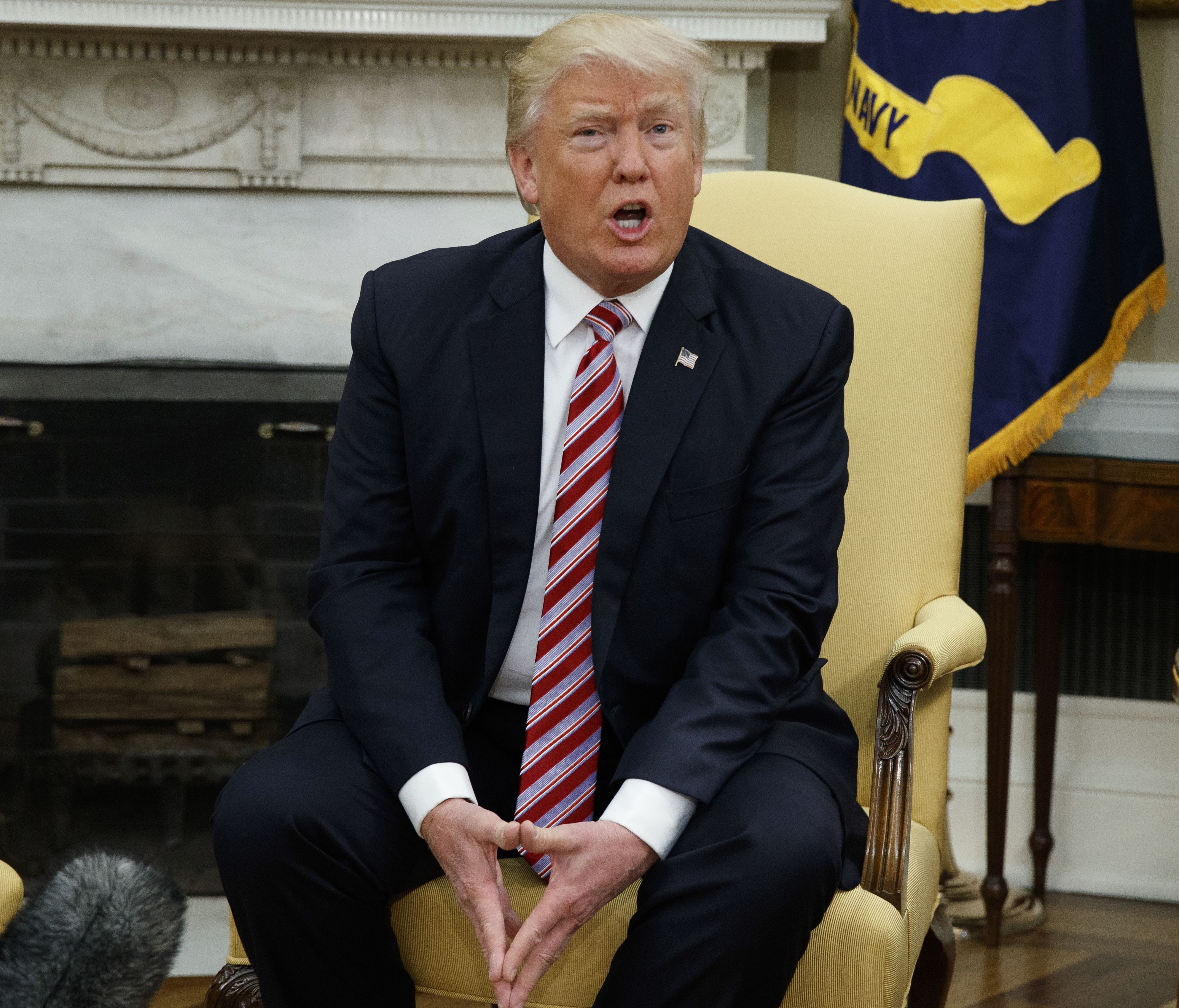 President Trump talks to reporters during a meeting with Henry Kissinger in the Oval Office on May 10, 2017.