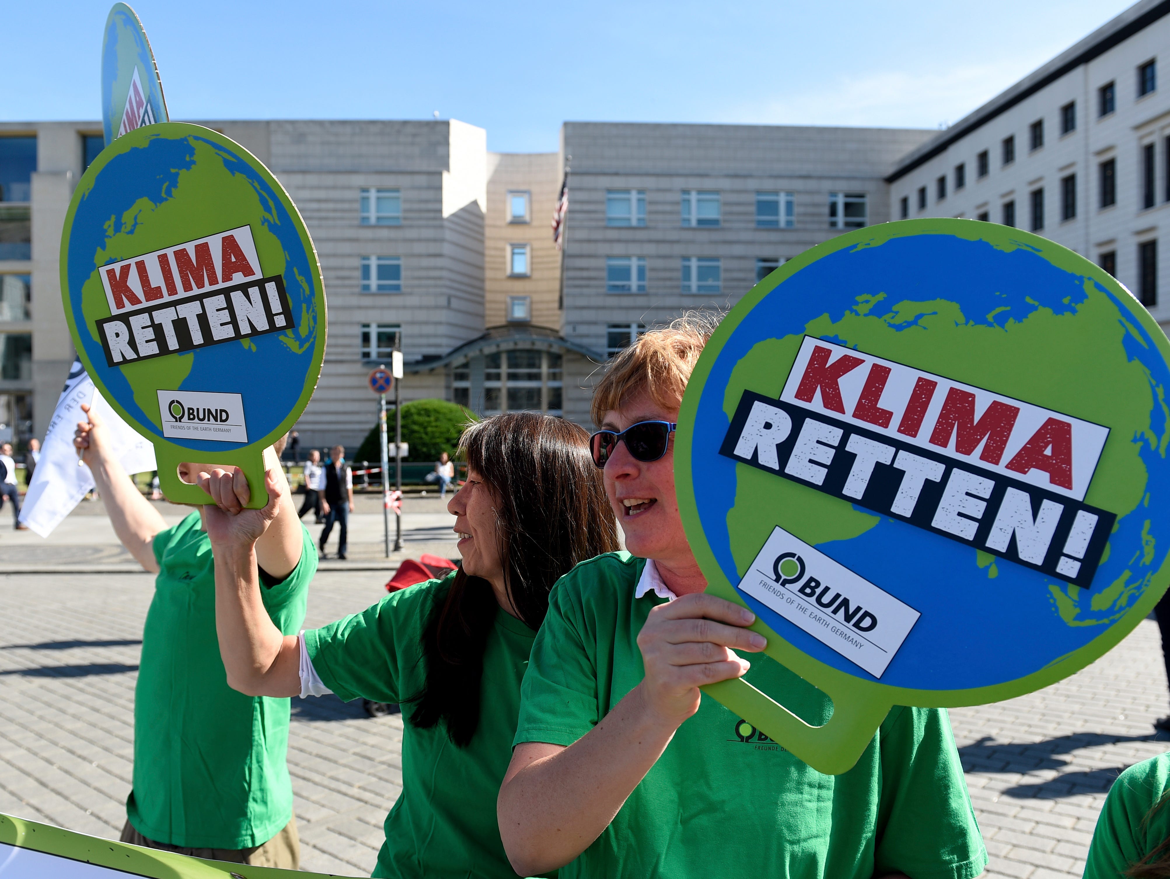 Members of the  German environment organization BUND demonstrate in Berlin, on June 1, 2017. Posters read: 'Save Climate.'