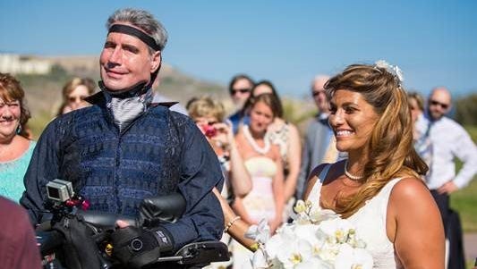 Augie Nieto, with the assistance of a machine, walked his daughter down the aisle.