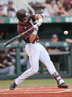 Mississippi State's Brent Rooker (19) swings at a pitch.