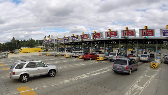 Cars pull into the toll booths in Tarrytown after crossing the Tappan Zee Bridge Aug. 27, 2015.