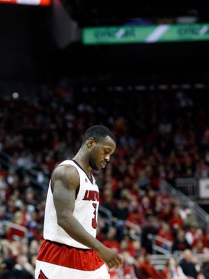 Louisville's Chris Jones walks off the court during a timeout on Saturday.
