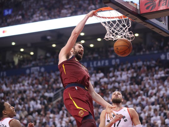 Cleveland Cavaliers forward Kevin Love (0) dunks the
