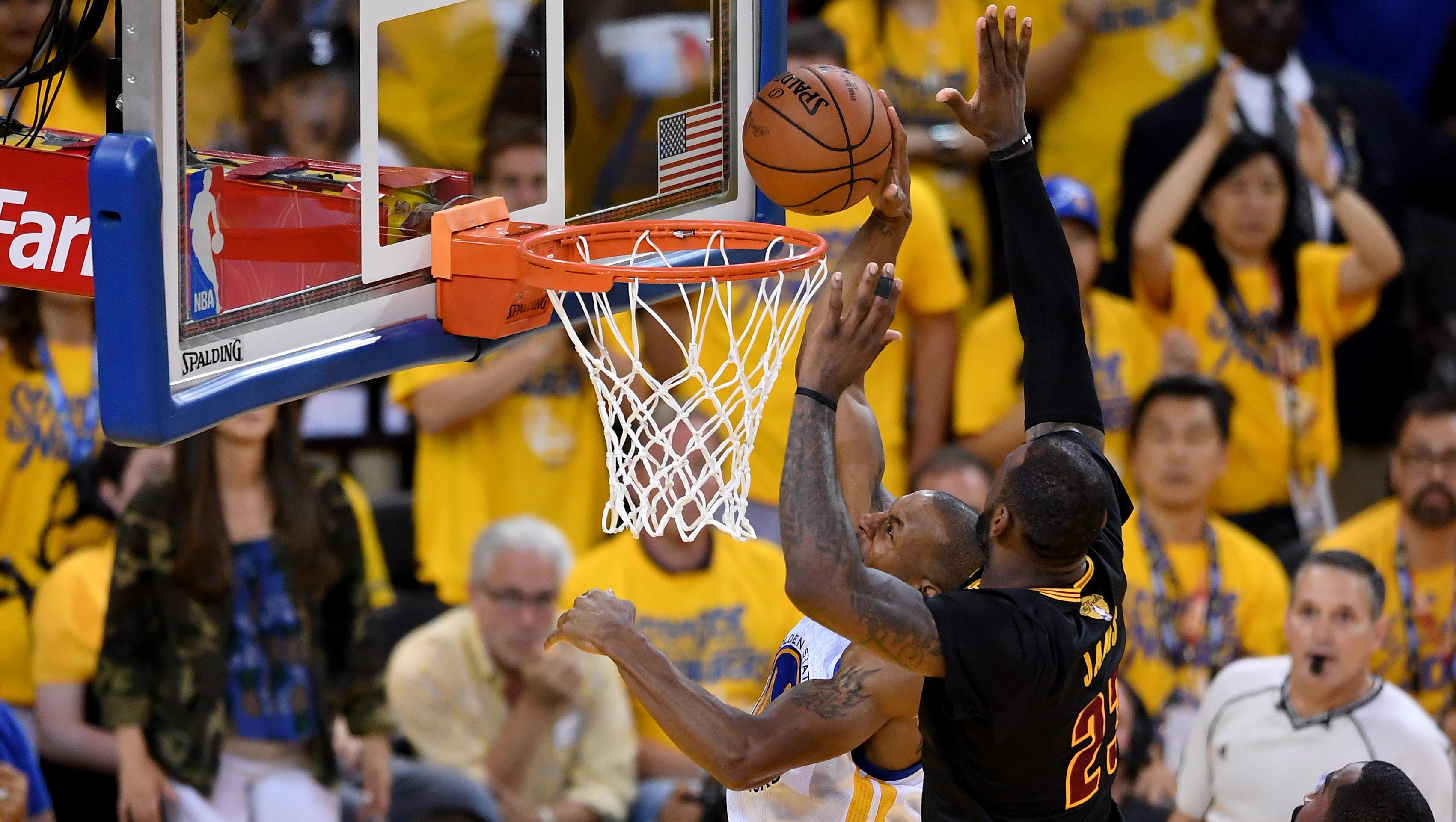 Warriors greeted by poster of LeBron James' block from NBA Finals