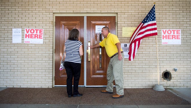 Barbara Goff (left) and Bill Oglesby head inside to vote at Bellevue Baptist Church on Thursday, Nov. 3, 2016, the final day of early voting in Tennessee.