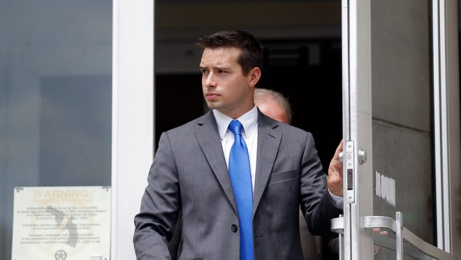 Former Madison, Ala., police officer Eric Sloan Parker walks out of the federal courthouse,  Sept. 9, 2015, in Huntsville, Ala. Parker, accused of using excessive force against an Indian grandfather. is being retried for civil rights violations as his first trial ended in a hung jury.