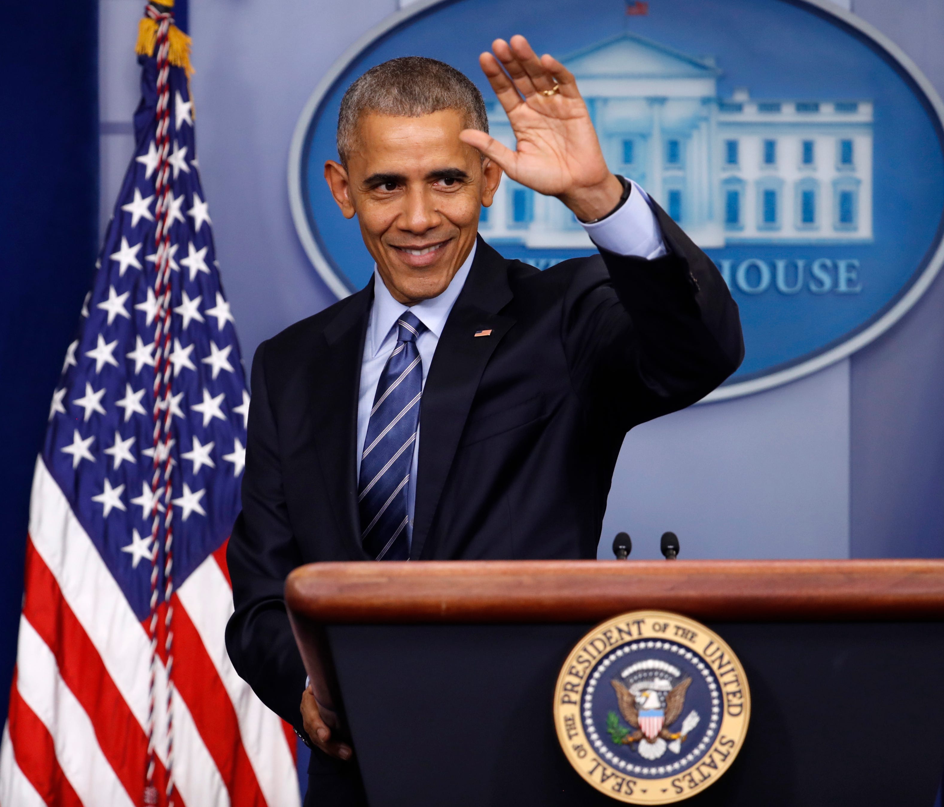 President Barack Obama waves at the conclusion of his news conference in the briefing room of the White House in Washington, Dec. 16, 2016.