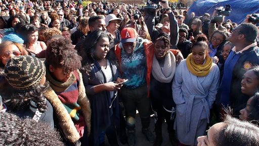 Supporters gather after the announcement that University of Missouri System President Tim Wolfe would resign Monday, Nov. 9, 2015, in Columbia, Mo. Wolfe resigned Monday with the football team and others on campus in open revolt over his handling of racial tensions at the school. (Matt Hellman/Missourian via AP) MANDATORY CREDIT 