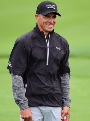 Kelly Slater reacts to James Hahn's birdie on the 12th hole during Round One of the AT&amp;T Pebble Beach Pro-Am at Monterey Peninsula Country Club on February 9, 2017 in Pebble Beach, California. (Photo by Harry How/Getty Images)