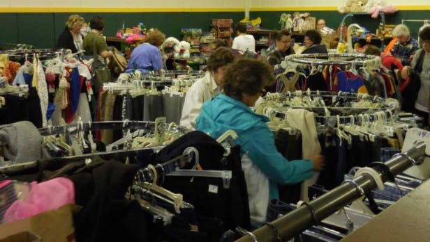 Shoppers look for bargains at a Martin Luther Guild rummage sale. The sale could grow into a year-round store in West Allis.