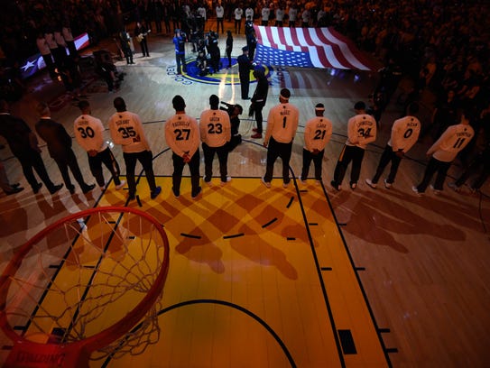 Golden State Warriors players line up for the national