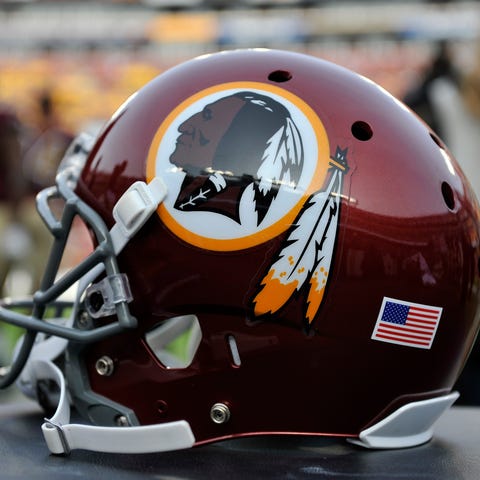 A Washington Redskins helmet sits on the sideline 