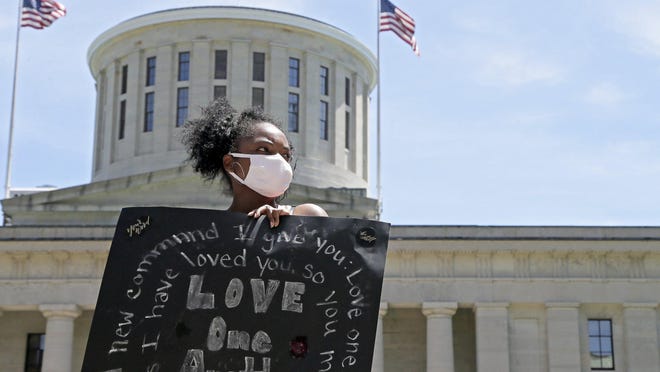 Lamiqua Nowell of Columbus demonstrates with the Xenos Church at the Ohio Statehouse in Columbus on Sunday, June 7, 2020.