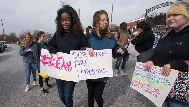 About 20 students walked out of Red Lion Area Senior High School Wednesday to mark the one-month anniversary of the Marjory Stoneman Douglas school massacre in Parkland, Florida.