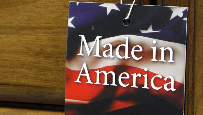 In this March 16, 2012 file photo, a "Made in America" tag hangs on a chest of drawers at a furniture factory in Lincolnton, N.C.