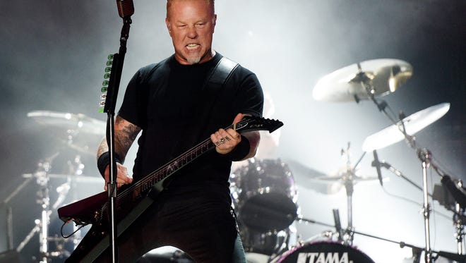 FILE - In this July 29, 2017, file photo, James Hetfield of Metallica performs during the band's concert at The Rose Bowl in Pasadena, Calif. Metallica and Dave Matthews are headlining a wildfire relief concert on Nov. 9, 2017, in San Francisco. (Photo by Chris Pizzello/Invision/AP, File)