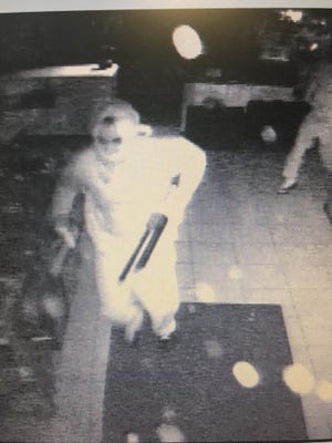 A burglary suspect is shown in video footage from Milan Pawn Shop, which was broken into early Monday morning.