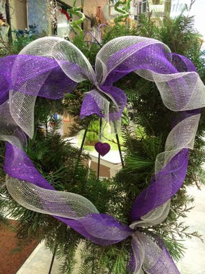 Free boughs of evergreen and dried garden materials can by used to make interesting wreaths.