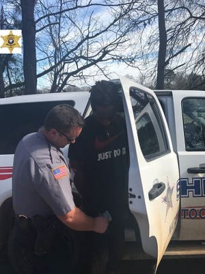 Ernest Calvin Meeks Jr. is put into a Natchitoches Parish Sheriff's Office patrol unit after his capture this afternoon. He is wanted on a rape charge in Kansas City, Missouri, according to a release.