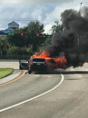 A motorist escaped safely after a car caught fire off Interstate 95 in Vero Beach Sept. 8, 2017.