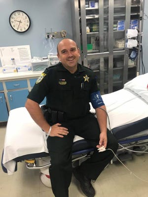Franklin County Sheriff's Deputy Wesley Creamer dove into cold water to save a woman who fell from a sea wall of the Saint George Island bridge Sunday.