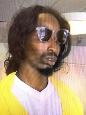 Knoxville police are working to identify this man, who robbed the AT&T store, 5400 Clinton Highway, on Sunday, Aug. 5, 2018, while wearing women's clothing.