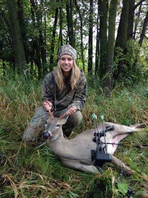 Morgan Van Lanen poses with her first deer.