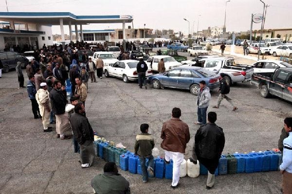 Libyans line up at a newly reopened gas station in the town of Nalut, southwest of Tripoli and close to the Tunisian border. The station was closed for several days because of the national uprising against Libyan dictator Moammar Gadhafi, which is still raging in parts of the country.