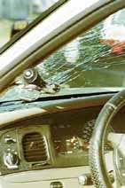 State Trooper Steve Fisher, when confronting the subject Gary Sorrell, car was struck by Sorrell with a street sign causing the windshield to crack and the driver-side window to shatter and fall out on Monday afternoon on Old Dixey Highway.