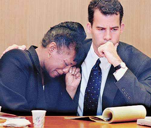 After the verdicts were published, Bernice Edwards weeps on the shoulder of her attorney, Paul Sisco. Edwards was found not guilty in the grand theft and racketeering trial against her and Rev. Henry Lyons Saturday, Feb. 27, 1999 at the Pinellas County Criminal Justice Center, Largo, Fla.