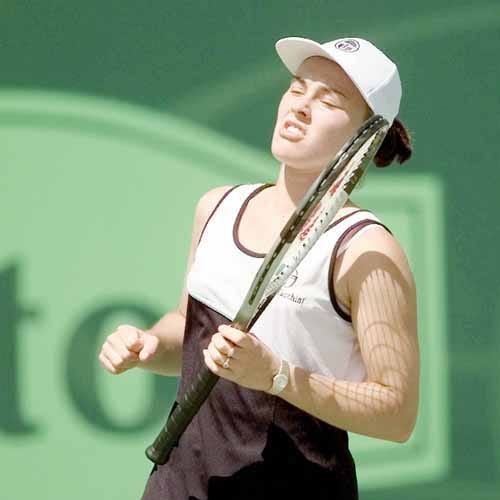 Martina Hingis pumps her fist after she defeated Barbara Schett Wednesday to advance to the semifinals of the Lipton Championships.