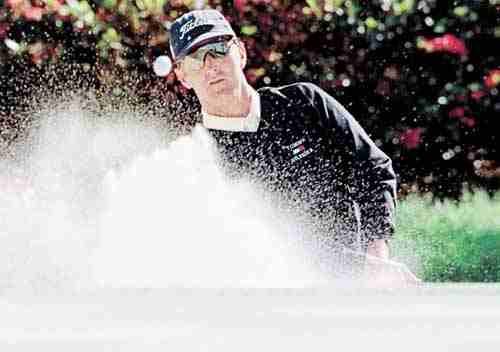 David Duval of Jacksonville Beach, Fla., hits out of the sand on the ninth hole during the third round of The Players Championship in Ponte Vedra Beach, Fla., Saturday, March 27, 1999. Duval started the round one stroke off the lead.