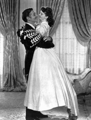 Clark Gable as Rhett Butler embraces Vivien Leigh as Scarlett O'Hara in the film "Gone With The Wind." Their love affair is a predominant theme of the 1939 classic.