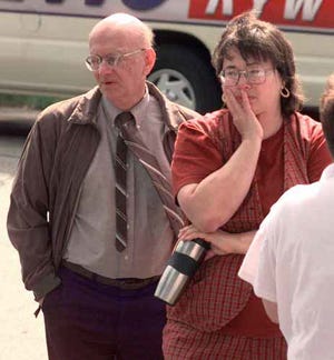 Two Norristown State Hospital employees who would not give their names react as they hear that a former male nurse who had been holding two nursing supervisors hostage in the hospital for three days had shot and killed one and injured the other Friday, June 18, 1999 in Norristown, Pa. Police say that nursing supervisor Carol Kepner was shot and killed by former nurse Dennis Czajkowski.